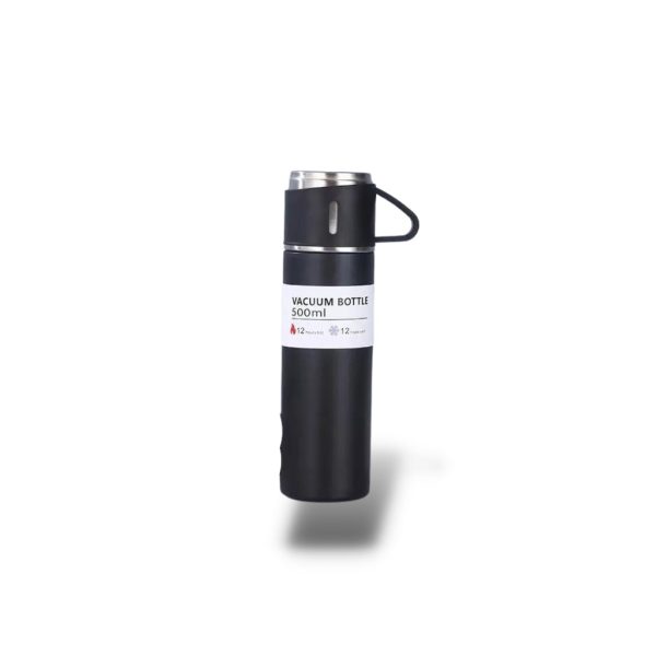 Thermos avec tasse sur table